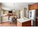 Well-designed kitchen with stainless steel refrigerator, dining area, and living room access at 3232 Cimarron Pl, Superior, CO 80027