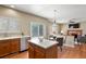 Open kitchen with eat-in table and seamless access to both living room and backyard at 3232 Cimarron Pl, Superior, CO 80027