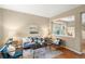 Comfortable living room with neutral tones, hardwood floors, and a staircase in view at 3232 Cimarron Pl, Superior, CO 80027