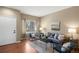 Inviting living room with hardwood floors, neutral walls, and stylish furnishings at 3232 Cimarron Pl, Superior, CO 80027