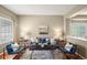 Cozy living room featuring hardwood floors, a plush sofa, and contemporary decor at 3232 Cimarron Pl, Superior, CO 80027