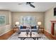 Cozy living room featuring hardwood floors, large window, and comfortable sofa at 3232 Cimarron Pl, Superior, CO 80027