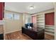 Well-lit office space with a large desk, built-in shelves, and ample workspace at 3232 Cimarron Pl, Superior, CO 80027
