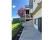 A fenced backyard with a concrete patio and a lovely blossoming tree at 11323 E Cimmarron Dr, Englewood, CO 80111