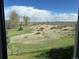 Spacious backyard with views of open space, accessed through a chain-link fence at 11323 E Cimmarron Dr, Englewood, CO 80111