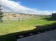 Fenced backyard with green grass and views of open space at 11323 E Cimmarron Dr, Englewood, CO 80111