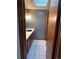 Powder room with wood cabinet, and patterned wall at 11323 E Cimmarron Dr, Englewood, CO 80111