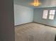 Bedroom with carpet, blue walls and window at 11323 E Cimmarron Dr, Englewood, CO 80111