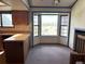 An eat-in kitchen features ample counter space, wood cabinets, and a large bay window offering natural light at 11323 E Cimmarron Dr, Englewood, CO 80111