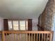 The living room features a brick fireplace and a large bay window at 11323 E Cimmarron Dr, Englewood, CO 80111