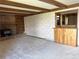 The living room showcases a unique bar area, brick fireplace, and built-in shelves at 11323 E Cimmarron Dr, Englewood, CO 80111