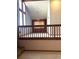 The living room features a vaulted ceiling and a contemporary chandelier at 11323 E Cimmarron Dr, Englewood, CO 80111