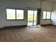 Bright room with an open sliding glass door leading to the backyard at 11323 E Cimmarron Dr, Englewood, CO 80111