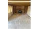 The living room features a brick fireplace and built-in shelves, enhancing the room's focal point at 11323 E Cimmarron Dr, Englewood, CO 80111