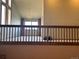 A living room with high ceilings, brick fireplace, and contemporary chandelier at 11323 E Cimmarron Dr, Englewood, CO 80111