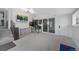 Bright game room with a pinball machine, TV, and sliding door at 3057 S Fox St, Englewood, CO 80110