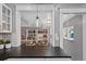 Kitchen island with black countertops and seating, open to a cozy living space at 3057 S Fox St, Englewood, CO 80110