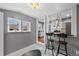 View of the kitchen through an opening, featuring a breakfast bar and stainless steel appliances at 3057 S Fox St, Englewood, CO 80110