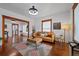 Bright living room showcasing hardwood floors, natural light, wood trim and stylish furniture at 3057 S Fox St, Englewood, CO 80110