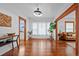 Bright living room showcasing hardwood floors, large windows, and stylish decor at 3057 S Fox St, Englewood, CO 80110