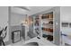 A view from the stairwell shows bookshelves and light from a window at 3057 S Fox St, Englewood, CO 80110