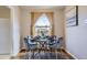 Cozy dining room featuring a modern table set, stylish chairs, and natural light from the window at 1701 W 50Th Ave, Denver, CO 80221