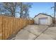 Detached one car garage with a new wood fence and alley access at 1701 W 50Th Ave, Denver, CO 80221