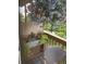 Cozy balcony featuring a chair and beautiful hanging flowers at 1606 Cottonwood Dr # 24S, Louisville, CO 80027