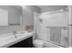 Cozy bathroom featuring updated vanity, toilet, and walk-in shower at 1606 Cottonwood Dr # 24S, Louisville, CO 80027