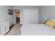 Bedroom featuring neutral walls, white linens, and closet at 1606 Cottonwood Dr # 24S, Louisville, CO 80027