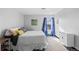 Bedroom with double bed, stylish curtains, and neutral decor at 1606 Cottonwood Dr # 24S, Louisville, CO 80027