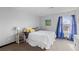 Bright bedroom with natural light, comfortable bedding, and neutral decor at 1606 Cottonwood Dr # 24S, Louisville, CO 80027