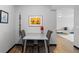 View of dining area with wood-look floors and view into living area at 1606 Cottonwood Dr # 24S, Louisville, CO 80027