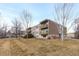 Apartment building featuring multiple levels of balconies and well-maintained landscaping at 1606 Cottonwood Dr # 24S, Louisville, CO 80027