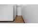 Hallway with wood floors, a front door, and a closet on the left at 1606 Cottonwood Dr # 24S, Louisville, CO 80027