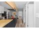 Modern kitchen with stainless steel appliances and butcher block countertops at 1606 Cottonwood Dr # 24S, Louisville, CO 80027