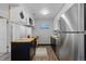 Stylish kitchen with stainless steel refrigerator, butcher block countertops, and modern cabinetry at 1606 Cottonwood Dr # 24S, Louisville, CO 80027