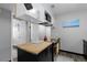 Galley kitchen featuring butcher block countertops and access to bedroom at 1606 Cottonwood Dr # 24S, Louisville, CO 80027