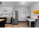 Bright kitchen features stainless steel appliances, butcher block counters, and wood-look flooring at 1606 Cottonwood Dr # 24S, Louisville, CO 80027