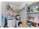 Functional laundry room features washer, dryer, shelving, and plenty of storage space at 1606 Cottonwood Dr # 24S, Louisville, CO 80027