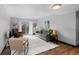 Bright living room with a gray sofa, wooden floors, and sliding glass doors to a balcony at 1606 Cottonwood Dr # 24S, Louisville, CO 80027