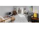 Bright living room with a gray sofa, wooden floors, and sliding glass doors to a balcony at 1606 Cottonwood Dr # 24S, Louisville, CO 80027
