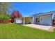 An inviting backyard featuring a well-maintained lawn, patio, and ample space for outdoor enjoyment and relaxation at 12935 Lake Circle Dr, Thornton, CO 80241