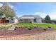 Well-maintained backyard with a covered patio, shed, garden, and lush green lawn, perfect for outdoor living at 12935 Lake Circle Dr, Thornton, CO 80241