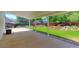 Relaxing covered patio with a view of the landscaped backyard at 12935 Lake Circle Dr, Thornton, CO 80241