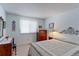 Relaxing bedroom with carpet floors, a decorative bed frame, and a cozy atmosphere at 12935 Lake Circle Dr, Thornton, CO 80241