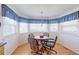 Breakfast nook with beautiful wood floors and natural lighting at 12935 Lake Circle Dr, Thornton, CO 80241
