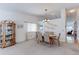 Cozy dining room with a chandelier, and traditional decor at 12935 Lake Circle Dr, Thornton, CO 80241