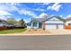 Charming single-Gathering home featuring a two-car garage and a beautifully landscaped front yard at 12935 Lake Circle Dr, Thornton, CO 80241