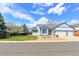 Charming single-Gathering home featuring a two-car garage and a beautifully landscaped front yard at 12935 Lake Circle Dr, Thornton, CO 80241